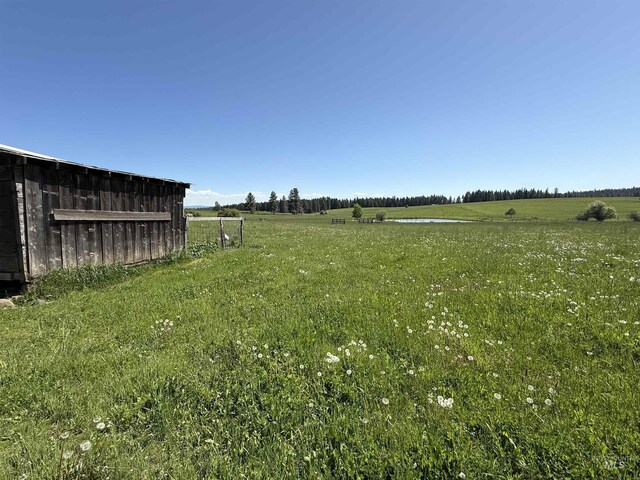 5656 Three Mile Rd, Weippe, ID 83553 - view of yard with a rural view and an outbuilding