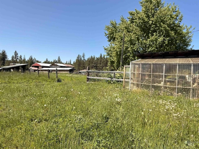 5656 Three Mile Rd, Weippe, ID 83553 - view of yard featuring a greenhouse and an outbuilding