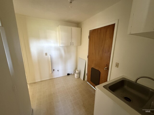5656 Three Mile Rd, Weippe, ID 83553 - laundry room featuring cabinet space and light floors