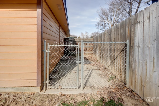 view of gate featuring fence