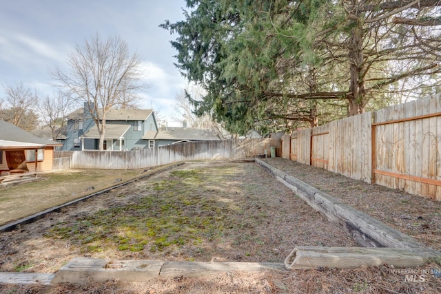 view of yard featuring a fenced backyard