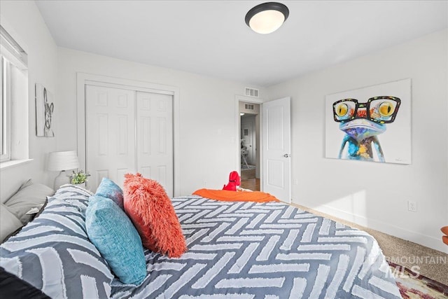bedroom with a closet and carpet floors