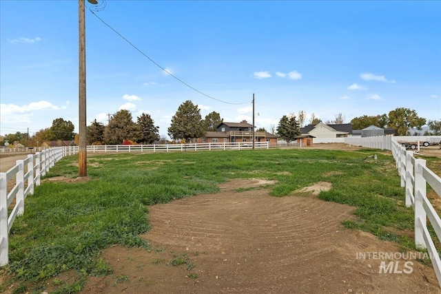 view of yard with a rural view