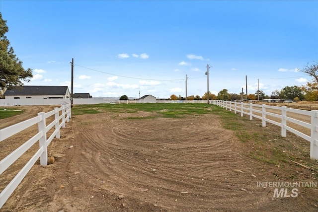 view of yard with a rural view