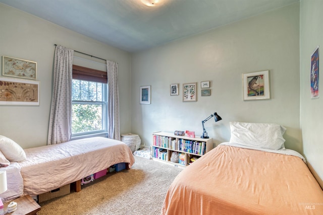 bedroom featuring carpet