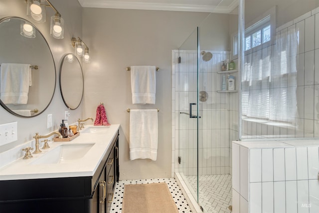 full bathroom featuring a sink, a stall shower, and ornamental molding