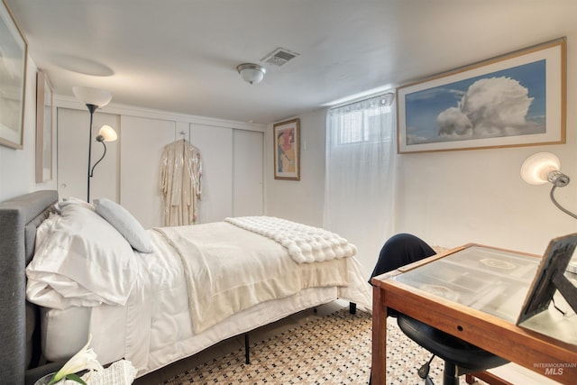 bedroom with visible vents