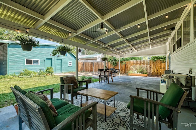 view of patio with an outdoor hangout area and fence