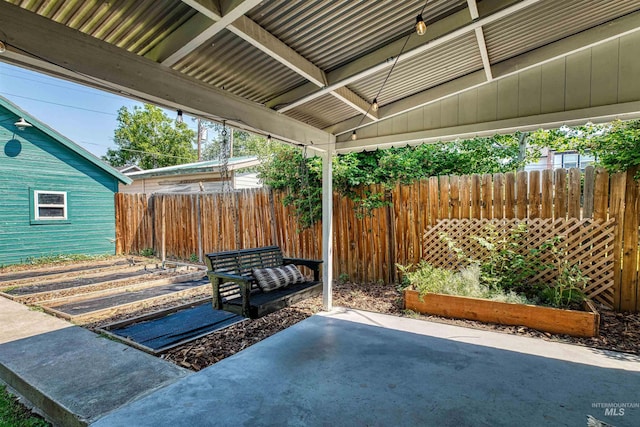 view of patio / terrace featuring fence