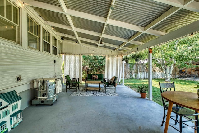 view of patio / terrace featuring outdoor dining space, an outdoor hangout area, and fence