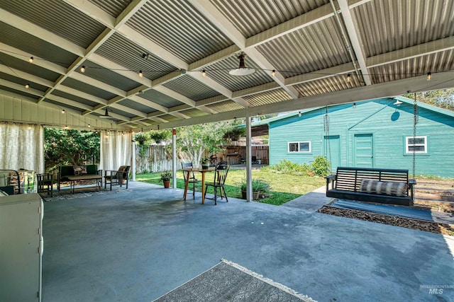 view of patio with an outdoor hangout area and fence