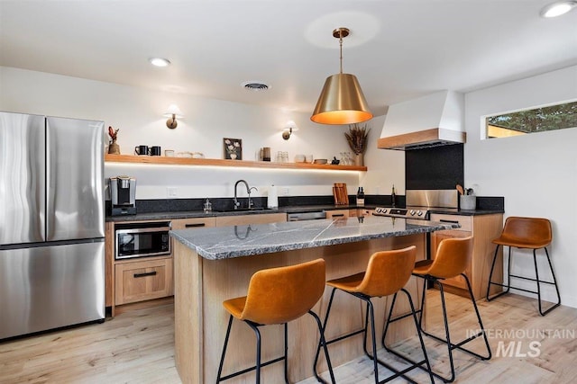 2672 E 4000 N, Twin Falls, ID 83301 - kitchen featuring stainless steel appliances, open shelves, premium range hood, a kitchen breakfast bar, and recessed lighting