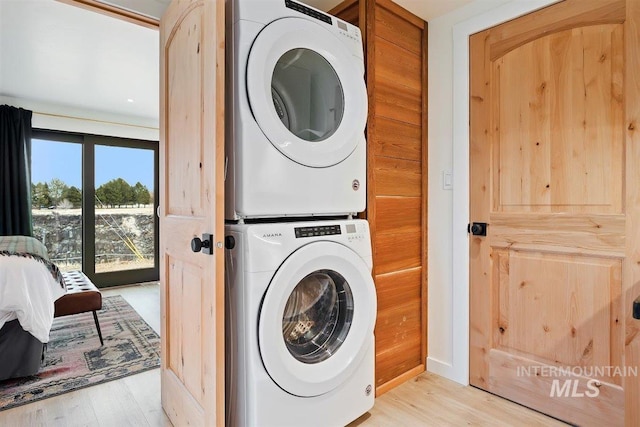 2672 E 4000 N, Twin Falls, ID 83301 - laundry room featuring stacked washer / drying machine and light wood-style floors
