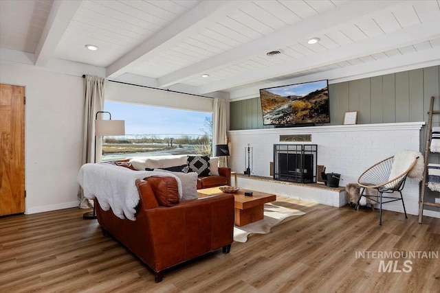 2672 E 4000 N, Twin Falls, ID 83301 - living area with wood finished floors, a fireplace, baseboards, and beamed ceiling