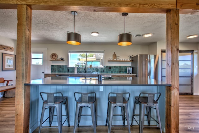 2672 E 4000 N, Twin Falls, ID 83301 - kitchen with freestanding refrigerator, open shelves, dark wood-style floors, dark countertops, and a textured ceiling