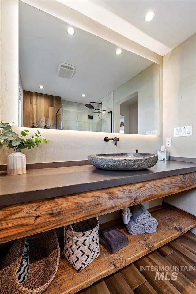 2672 E 4000 N, Twin Falls, ID 83301 - bathroom with vanity, walk in shower, wood finished floors, and recessed lighting