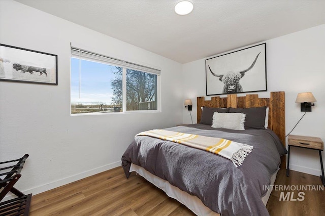 2672 E 4000 N, Twin Falls, ID 83301 - bedroom with wood finished floors and baseboards