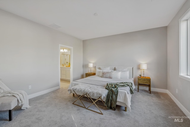 carpeted bedroom with connected bathroom