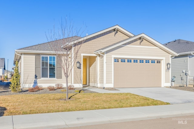 view of front facade with a front lawn and a garage