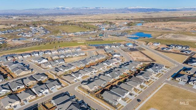 bird's eye view featuring a water and mountain view