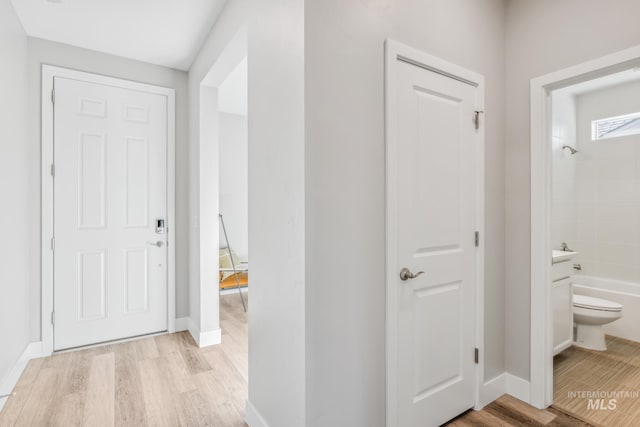 hall with light wood-type flooring