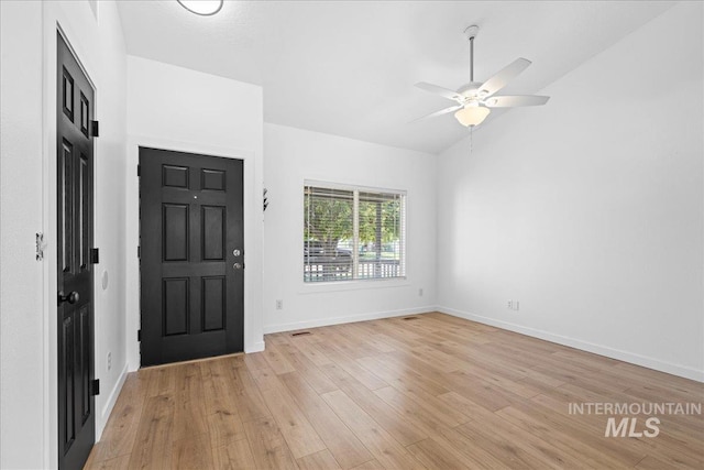 entrance foyer featuring light wood-type flooring, a ceiling fan, and baseboards