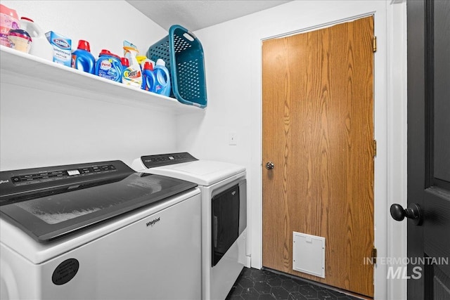 laundry area featuring independent washer and dryer and laundry area
