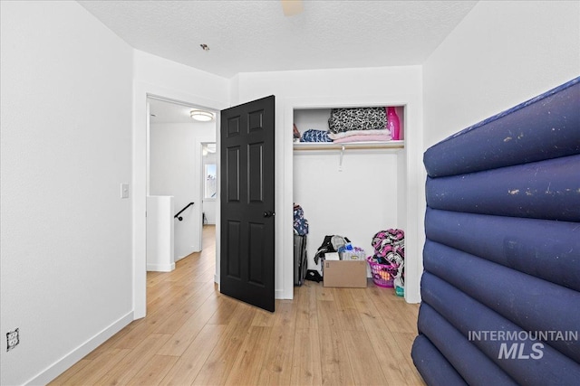 interior space with light wood-style floors and baseboards