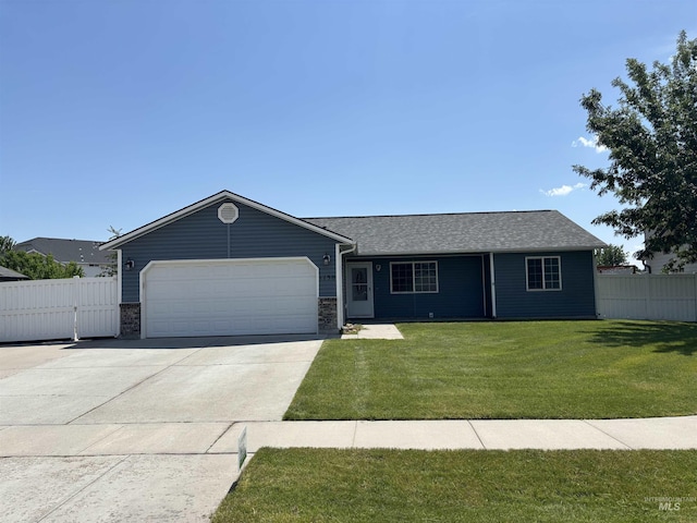 1150 NW 22nd St, Fruitland, ID 83619 - ranch-style home with an attached garage, concrete driveway, and a shingled roof