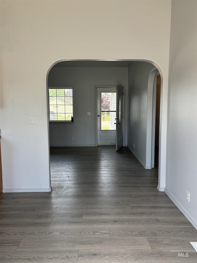 1150 NW 22nd St, Fruitland, ID 83619 - empty room with arched walkways and wood finished floors
