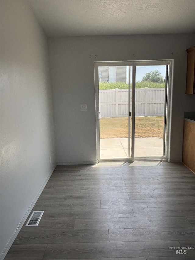 1150 NW 22nd St, Fruitland, ID 83619 - empty room with dark wood-style flooring