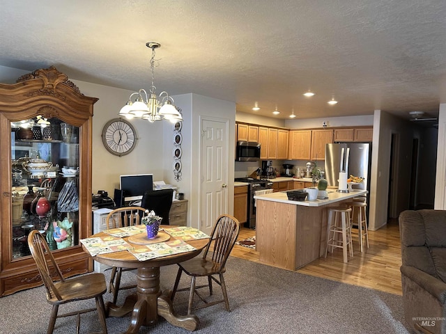 168 Long Is, Twin Falls, ID 83301 - dining area featuring light carpet, recessed lighting, a textured ceiling, and an inviting chandelier