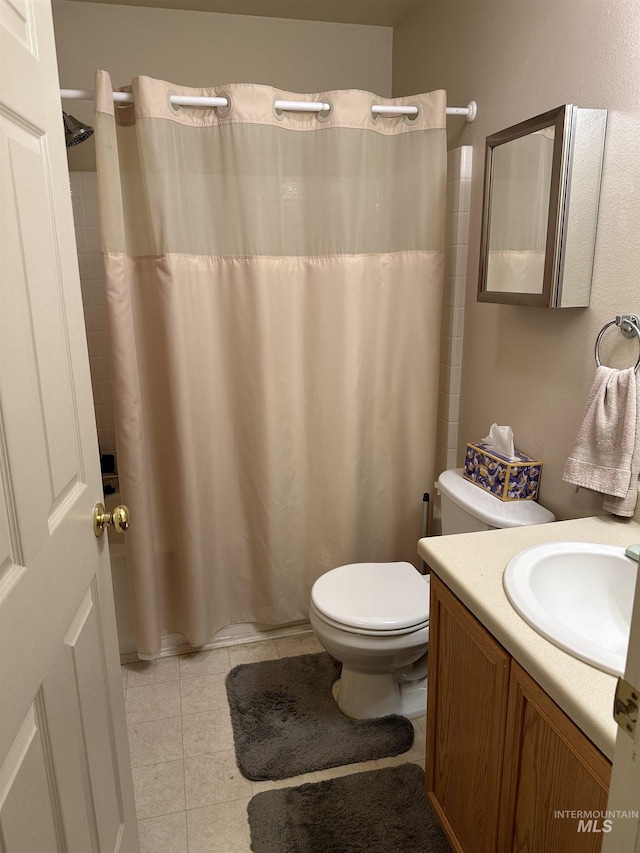 168 Long Is, Twin Falls, ID 83301 - bathroom featuring toilet, a shower with shower curtain, tile patterned flooring, and vanity