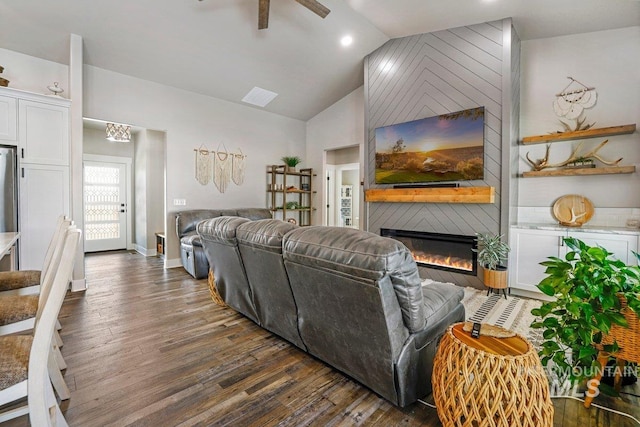 910 Blueridge Dr, Kimberly, ID 83341 - living area with dark wood finished floors, a fireplace, ceiling fan, baseboards, and high vaulted ceiling
