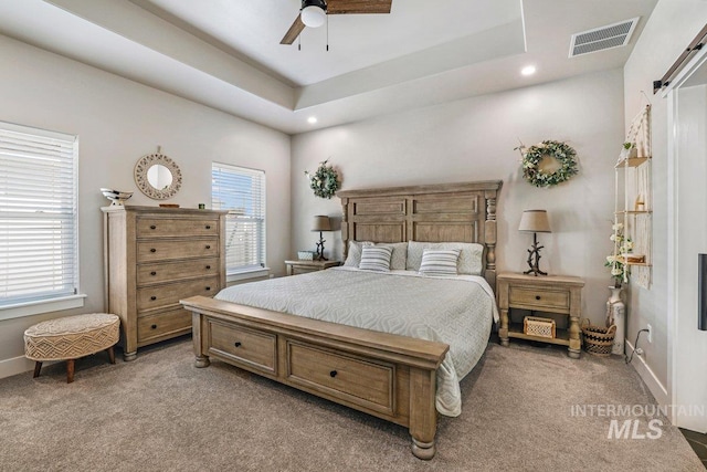 910 Blueridge Dr, Kimberly, ID 83341 - bedroom featuring light colored carpet, recessed lighting, a barn door, baseboards, and a ceiling fan