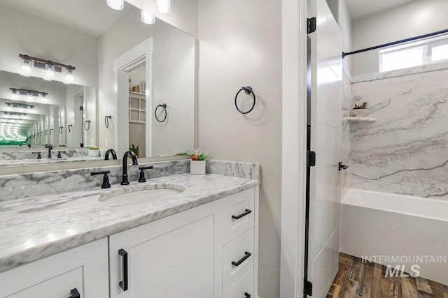 910 Blueridge Dr, Kimberly, ID 83341 - bathroom with wood finished floors, shower / bath combination, and vanity