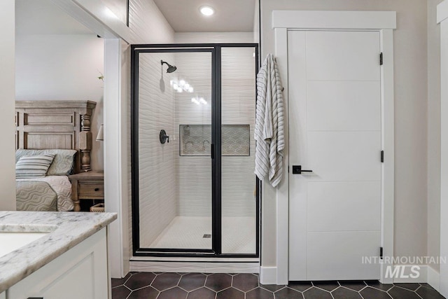 910 Blueridge Dr, Kimberly, ID 83341 - full bath with tile patterned floors, vanity, a shower stall, recessed lighting, and ensuite bath