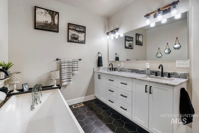 910 Blueridge Dr, Kimberly, ID 83341 - full bathroom with double vanity, tile patterned floors, a freestanding bath, and baseboards