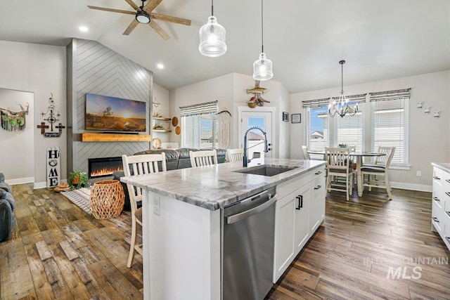 910 Blueridge Dr, Kimberly, ID 83341 - kitchen with stainless steel dishwasher, a sink, vaulted ceiling, ceiling fan, and a kitchen bar