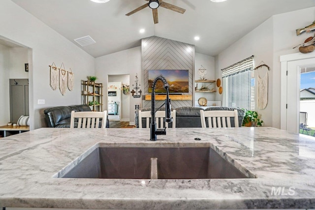 910 Blueridge Dr, Kimberly, ID 83341 - kitchen with a sink, open floor plan, a ceiling fan, light stone countertops, and lofted ceiling