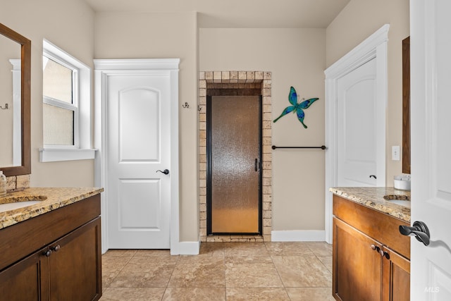 bathroom with tile patterned flooring and vanity