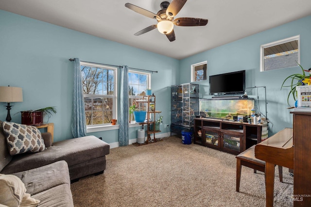 carpeted living room featuring ceiling fan