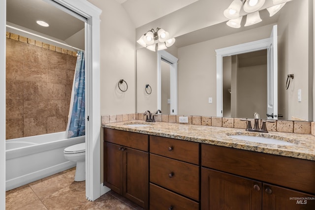 full bathroom featuring tile patterned floors, vanity, toilet, and shower / bath combo with shower curtain