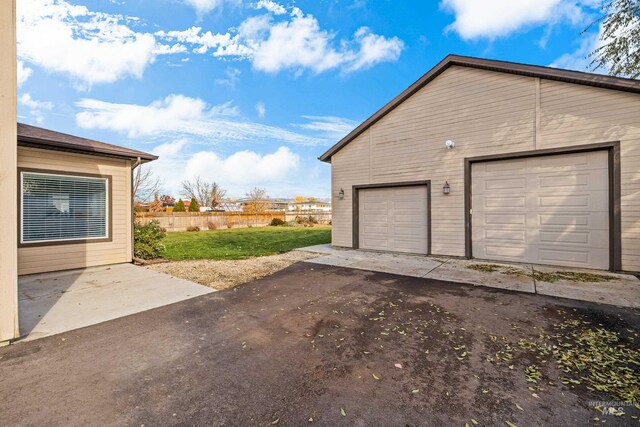 garage featuring a yard