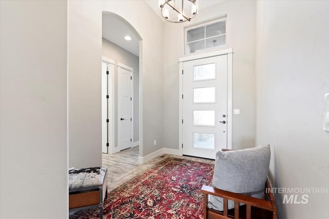 entryway featuring a chandelier