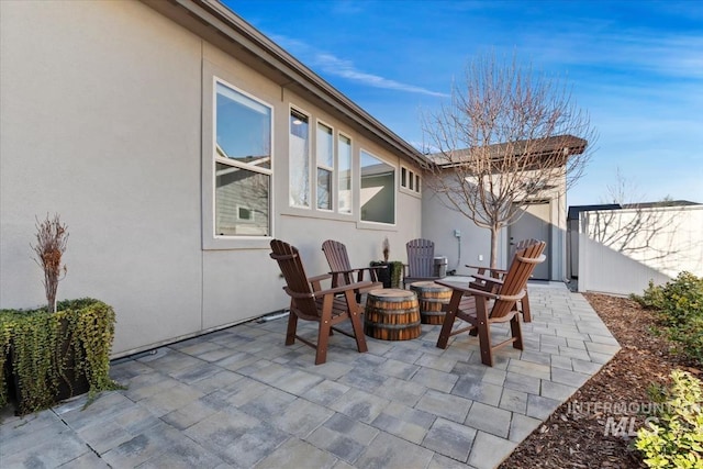 view of patio / terrace featuring a fire pit