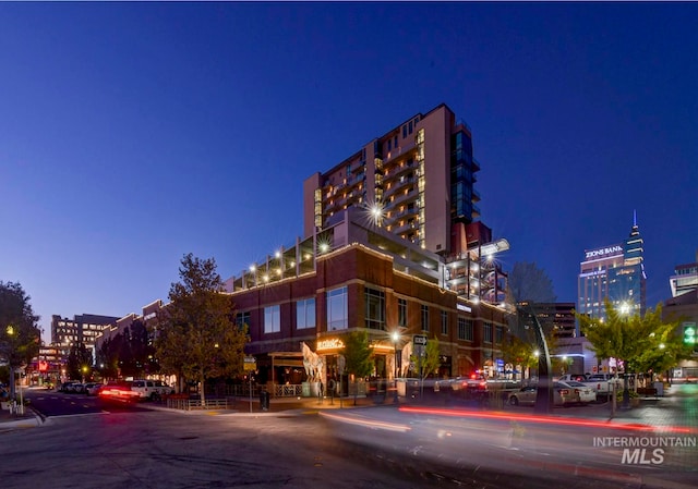 view of outdoor building at dusk