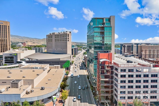 property's view of city with a mountain view