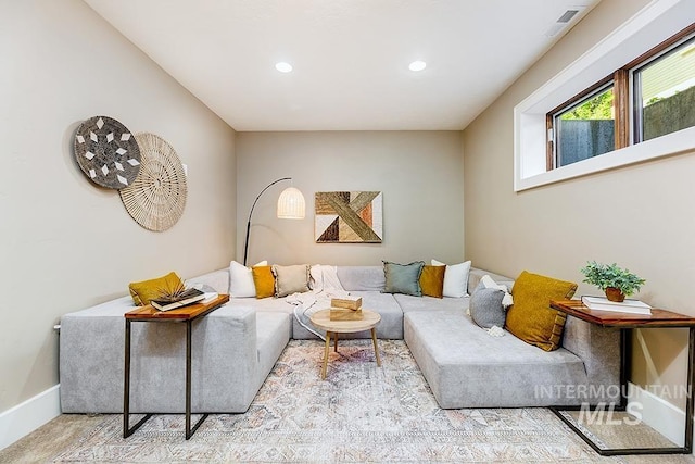 living room with recessed lighting and baseboards
