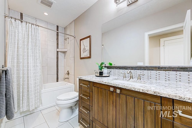 full bath with tile patterned flooring, toilet, shower / tub combo, and vanity